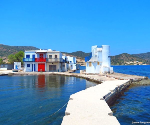 Whitewashed chapel and fishermen's houses at the water's edge on Milos