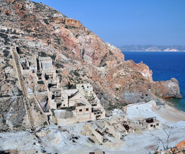Ruins on the rocky coastline of Milos above the sea